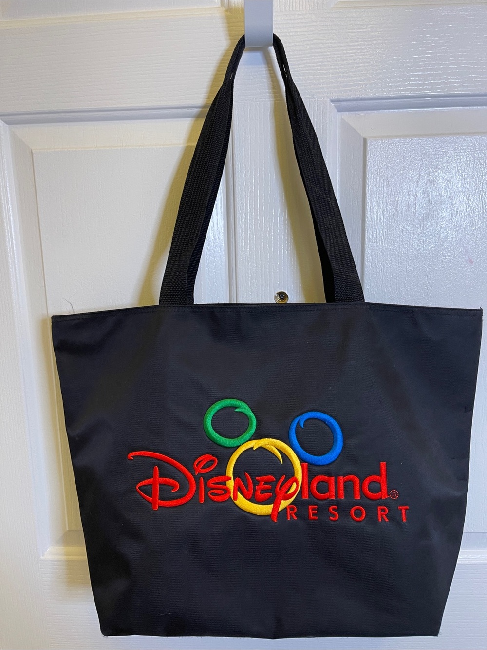 Disneyland Resort  A Black Tote with the Red, Yellow, Blue and Green Color Logo